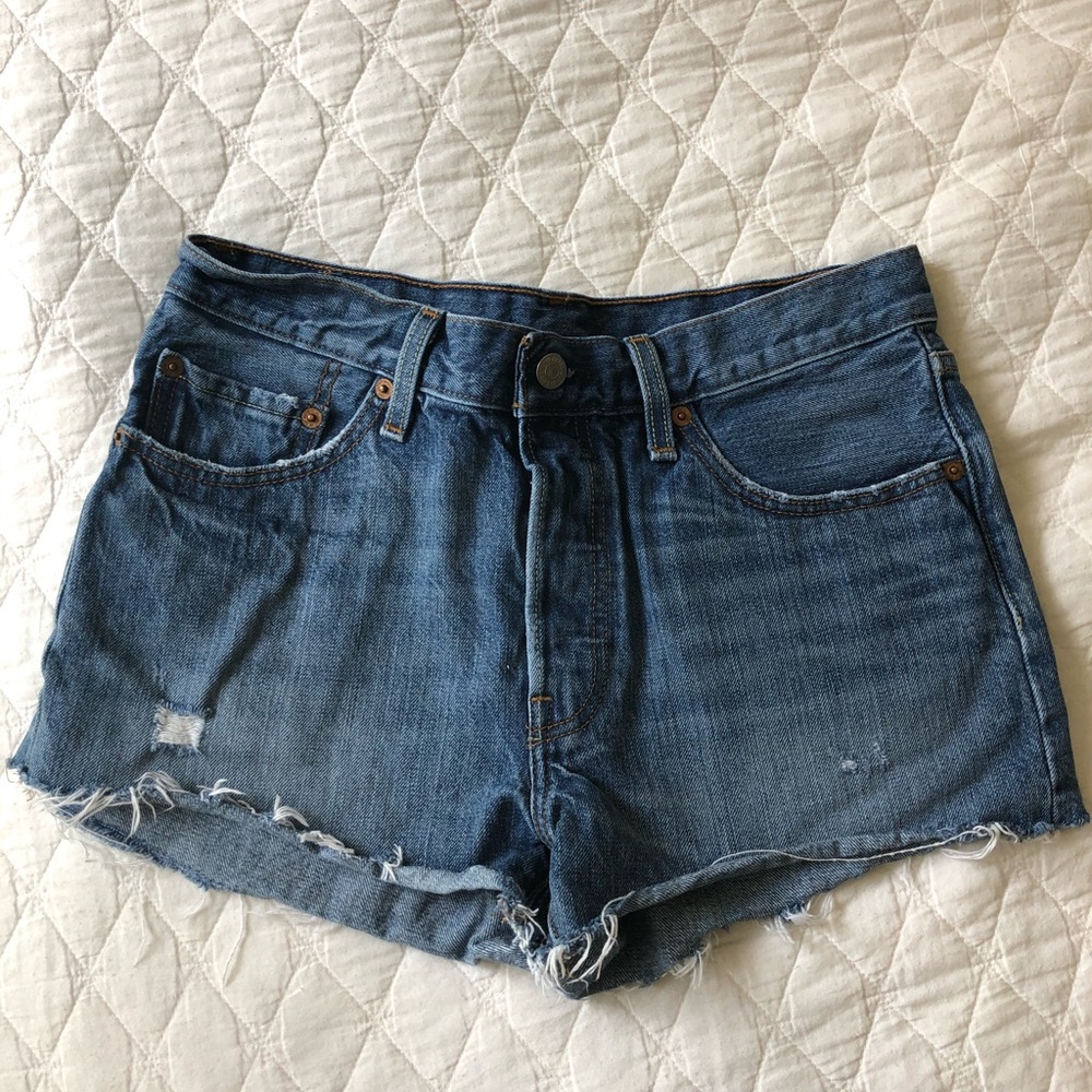 Levi’s size 28 mid rise distressed jean shorts